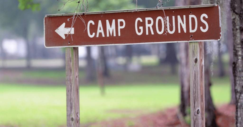 BEST CAMPINNG OPTION THIS IS AN IMAGE OF A CIGN THAT SAYS CAM GROUNDS
