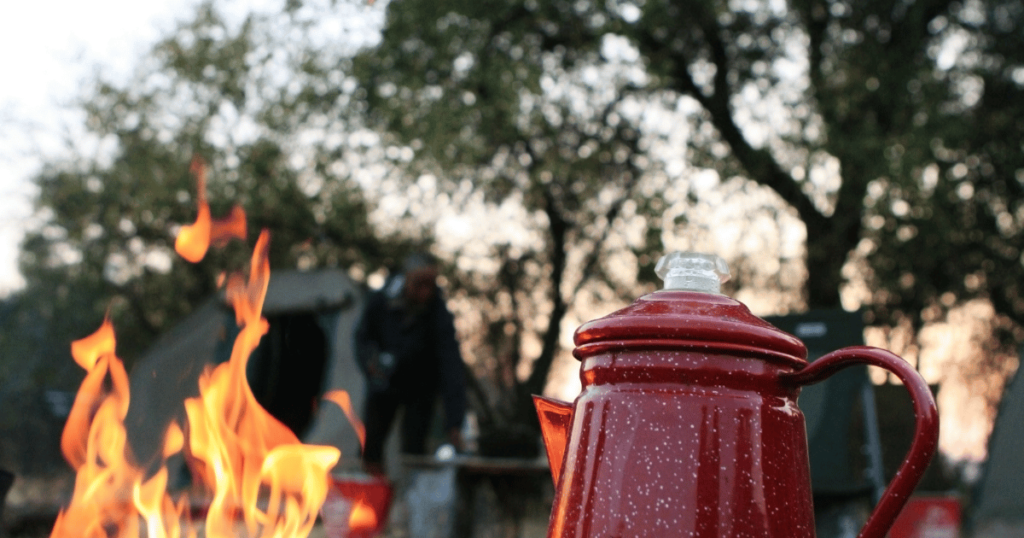 BEST CAMPING OPTION THIS IS AN IMAGE OF A CAMPFIRE AND A COFFEE POT