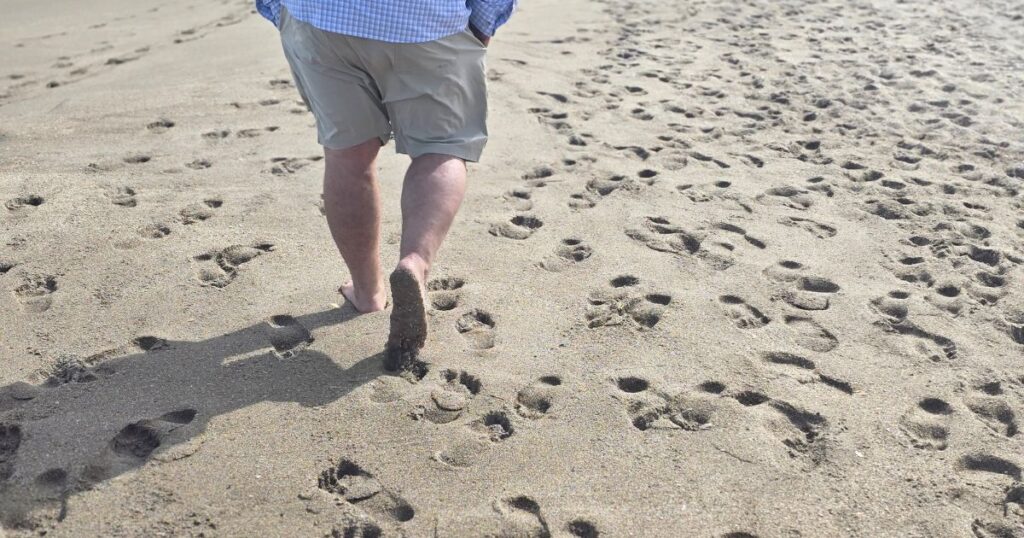 OFF-THE-BEATEN-PATH ST. AUGUSTINE THIS IS AN IMAGE OF A MAN WALKING DOWN THE BEACH