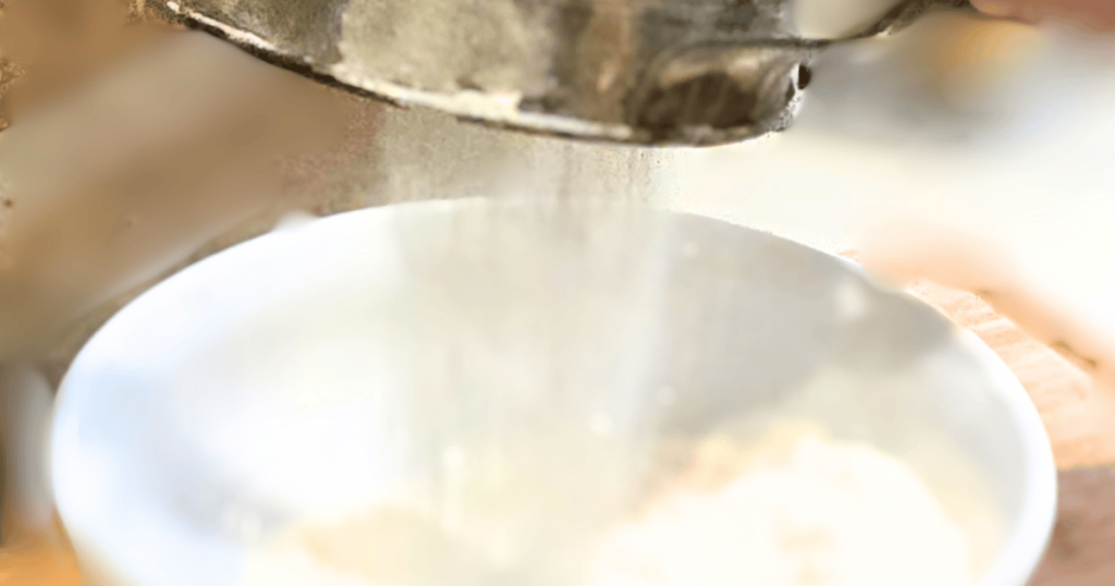 flour sifting into bowl