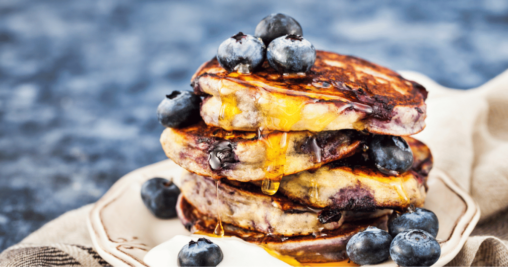 easy blueberry lemon pancakes for camping mornings STACK OF PANCAKES ON A PLATE