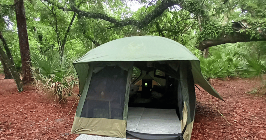 TENT UNDER CANOPY OF OAK TREES