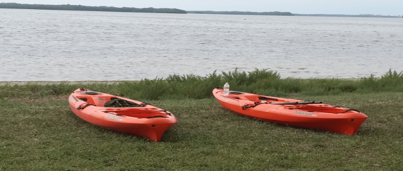 TWO KAYAKS ON SHORELINE AT FORT DE SOTO CAMPGROUND