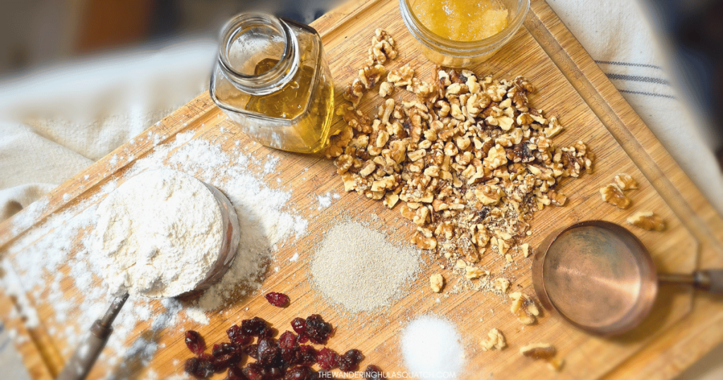 CRANBERRY WALNUT ARTISAN BREAD INGREDIENTS ON A BOARD