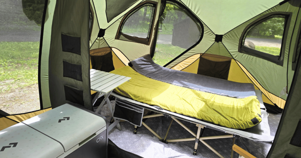 BEST CAMPING COT FOR COMFORTABLE OUTDOOR SLEEP INSIDE TENT COT PADS LAYED OUT ON COTS