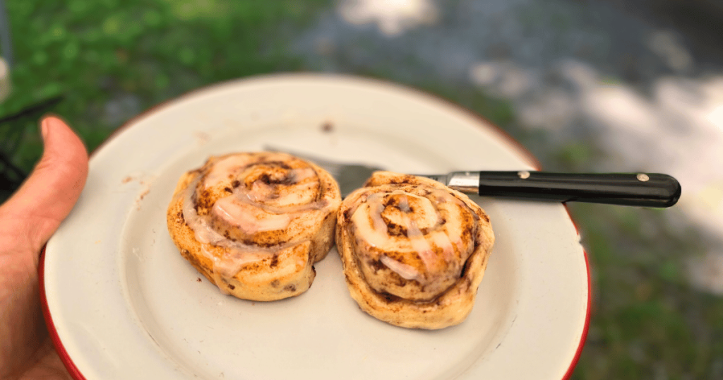 EASY CAMPING MEALS: SIMPLE CAPSULE MEAL PLANNING 2 cinnamon rolls on a plate