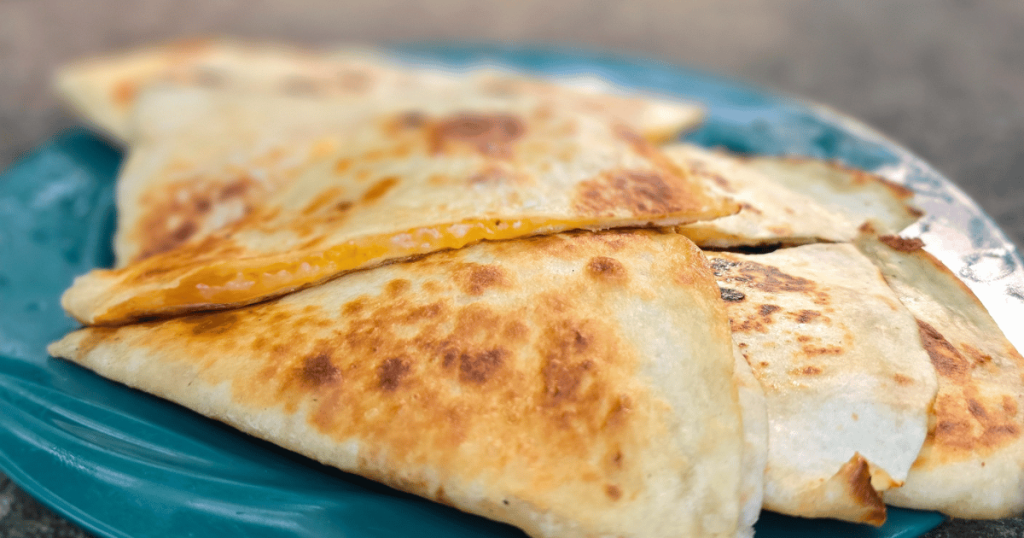 EASY CAMPING MEALS: SIMPLE CAPSULE MEAL PLANNING quesadillas on a plate