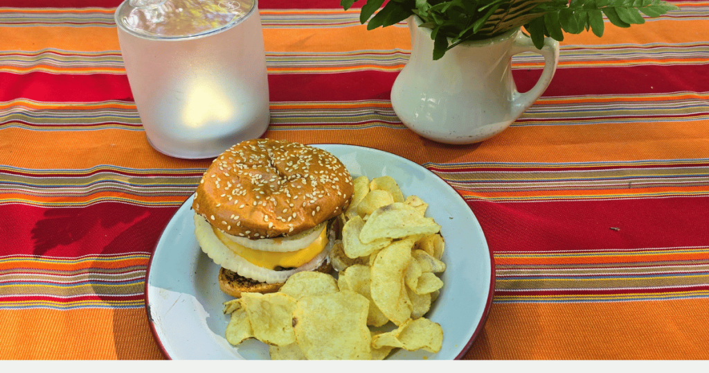 EASY CAMPING MEALS: SIMPLE CAPSULE MEAL PLANNING hamburger on a plate with chips