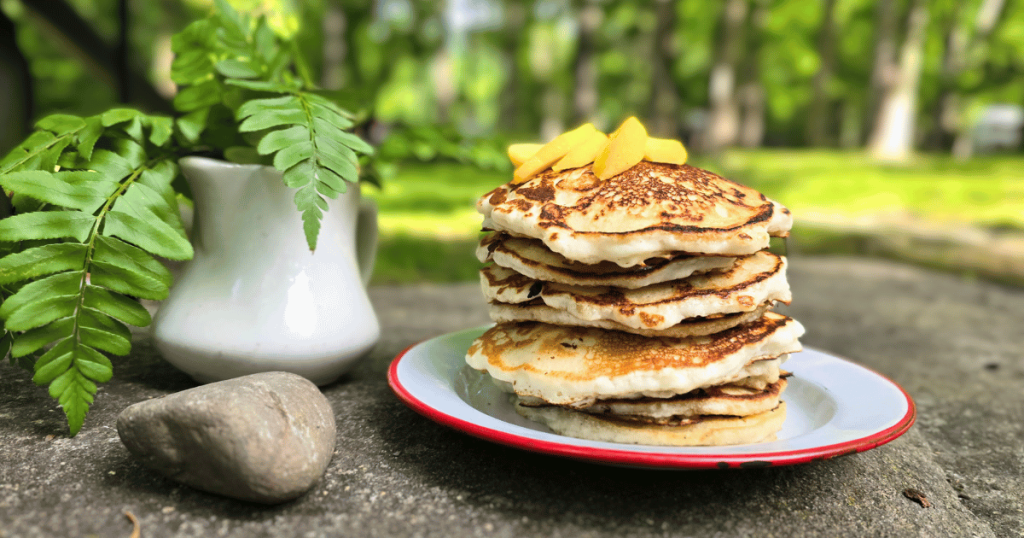 pancakes on a plate sitting on a rock