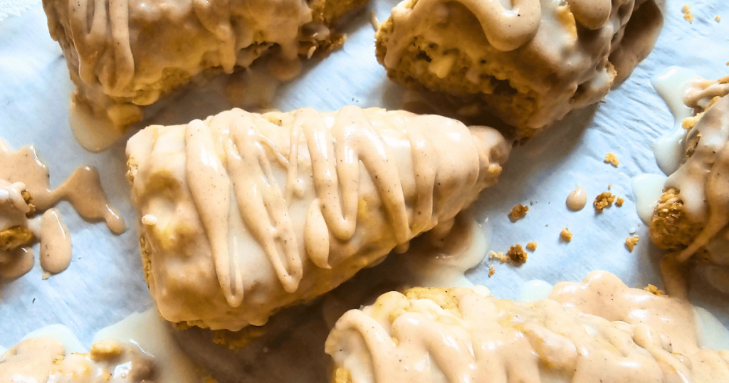 PUMPKIN WHITE CHOCOLATE SCONES WITH BOURBON MAPLE GLAZE SCONES ON A COOKIE SHEET