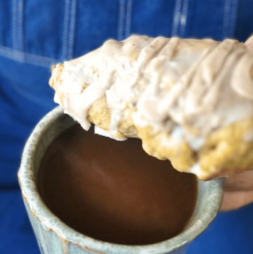 PUMPKIN WHITE CHOCOLATE SCONES WITH BOURBON MAPLE GLAZE MAN WITH COFFEE CUP AND SCONE