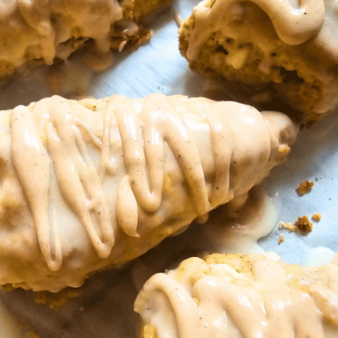 PUMPKIN WHITE CHOCOLATE SCONES WITH BOURBON MAPLE GLAZE SCONES ON A COOKIE SHEET