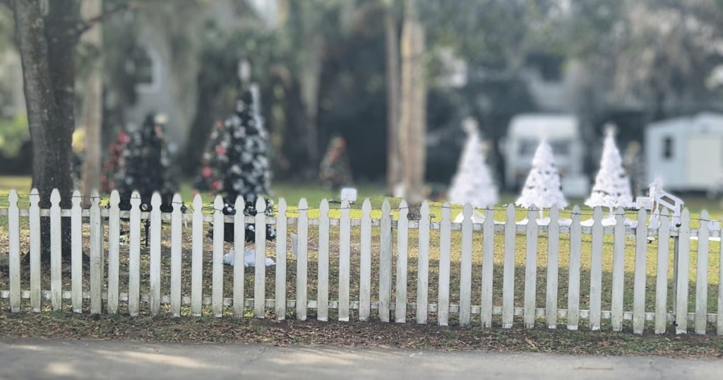 St. Augustine Nights of Lights Christmas in Florida WHITE PICKET FENCE WITH CHRISTMAS TREES