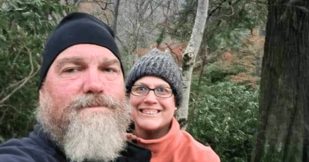 ULTIMATE CLOTHES GUIDE FOR YOUR FALL CAMPING TRIP MAN AND WOMAN IN WARM CLOTHES