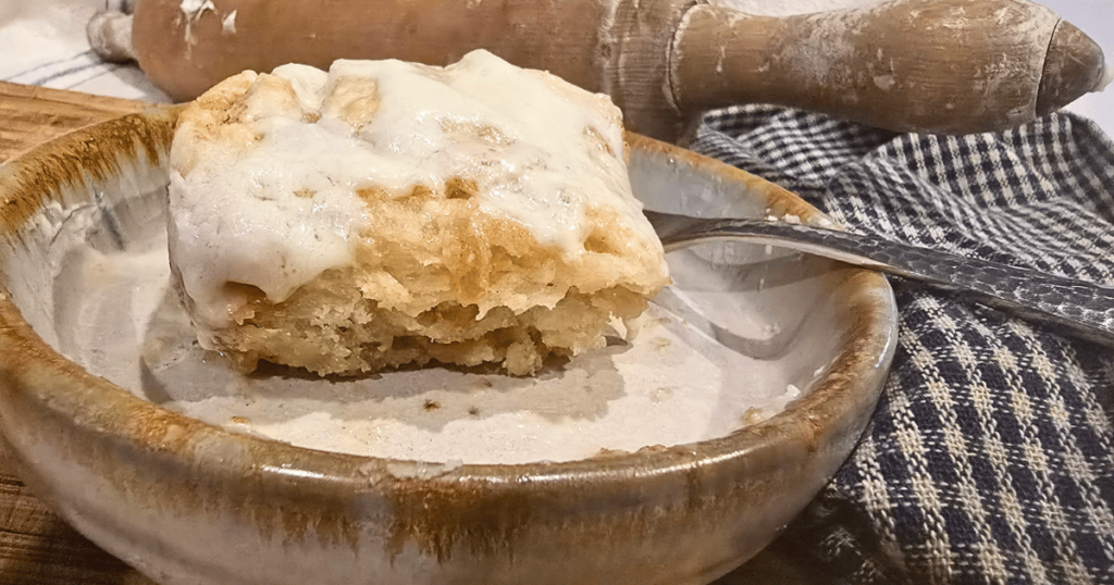 DECADENT HOMEMADE SOUR CREAM CINNAMON ROLLS RECIPE cinnamon roll on a plate
