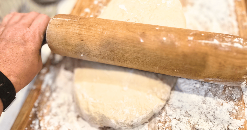 DECADENT HOMEMADE SOUR CREAM CINNAMON ROLLS RECIPE rolling out dough