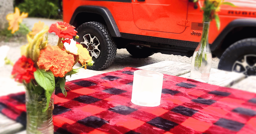 FALL OUTDOORS IN FLORIDA: GUIDE TO AUTUMN ADVENTURES picnic table with flowers on t and a jeep