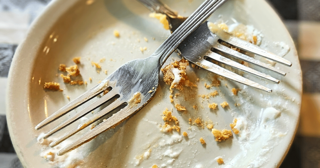 FAT WILLIE'S FISH CAMP BEST SEAFOOD DIVES IN FLORIDA EMPTY PLATE WITH TWO FORKS