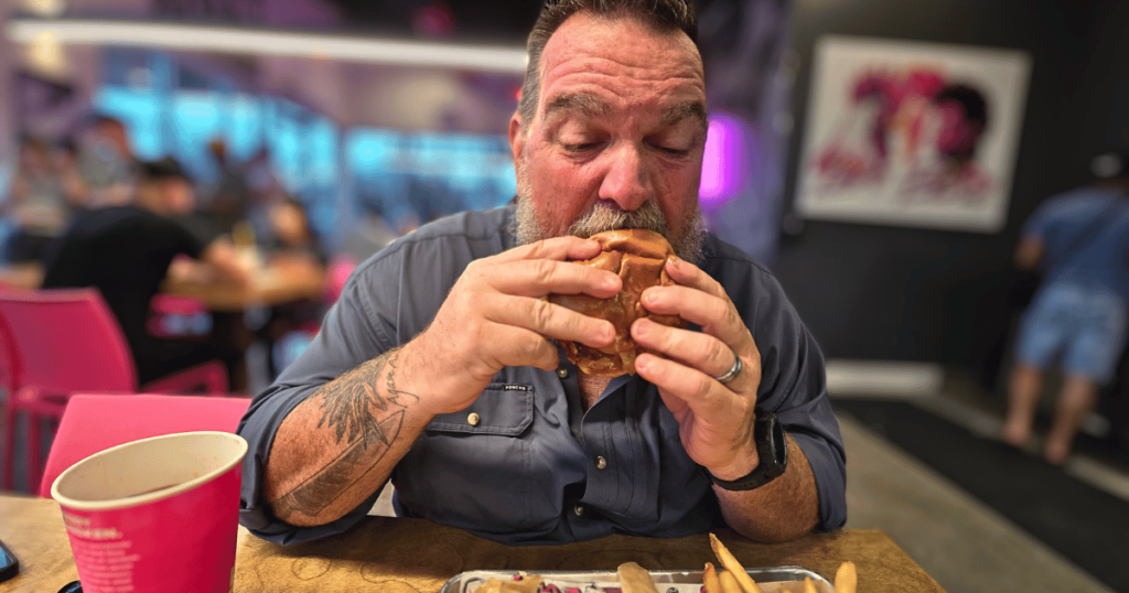 LOVEBIRD ALMOST FAMOUS CHICKEN CENTRAL FLORIDA HIDDEN GEM man eating chicken sandwich