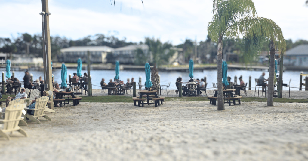 DIVE INTO CRUMPS' LANDING IN HOMOSASSA, FLORIDA this is an image of waterfront seating.
