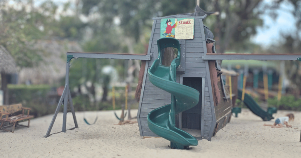 DIVE INTO CRUMPS' LANDING IN HOMOSASSA, FLORIDA this is an image of a dog laying down at the tiki bar. this is an image of funky props.