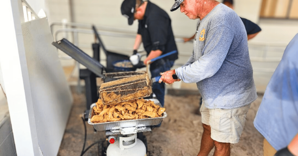 SOUTHERN CHURCH FISH FRY BEST SEAFOOD DIVES IN FLORID MEN FRIEING FISH