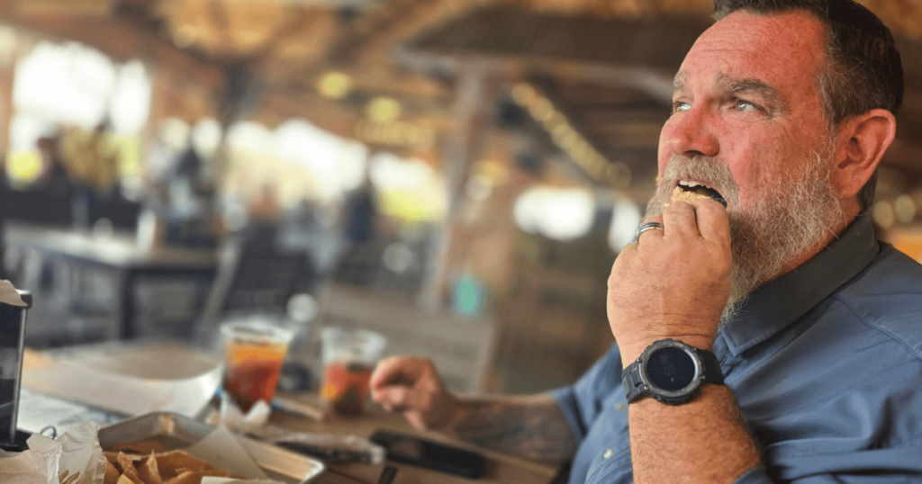 This is an image a man eating seafood in Homosassa, Florida.