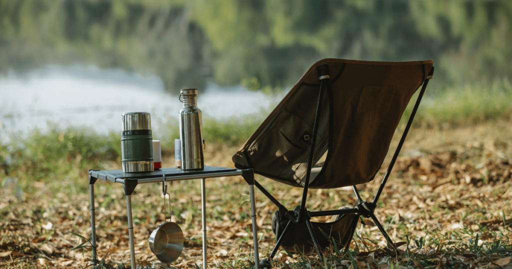 BEGINNERS GUIDE TO CAMPING THIS IS AN IMAGE OF a camping chair and a camping table with a thermos