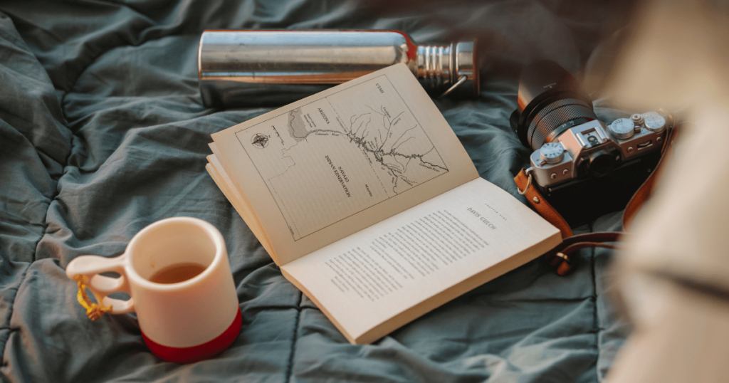 BEGINNERS GUIDE TO CAMPING THIS IS AN IMAGE OF hiking map and a cup of coffee