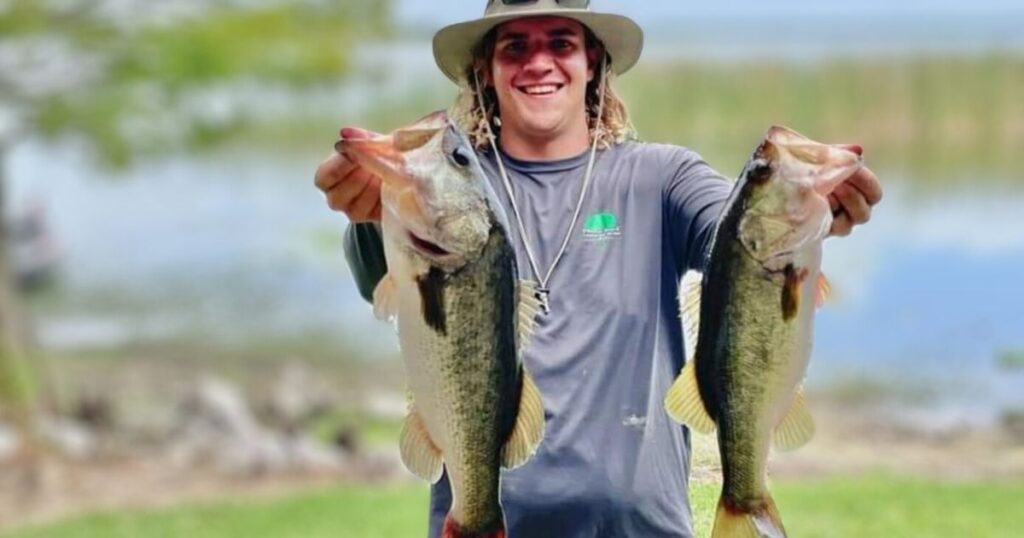 SOUTHERN FISH FRY PARTY IDEAS HIS IS AN IMAGE OF A MAN HOLDING TWO GIANT BASS.