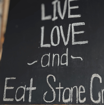 BEST SEAFOOD DIVES IN FLORIDA LIVE, LOVE AND EAT STONE CRAB SIGN AT CAMELLIA STREET GRILL