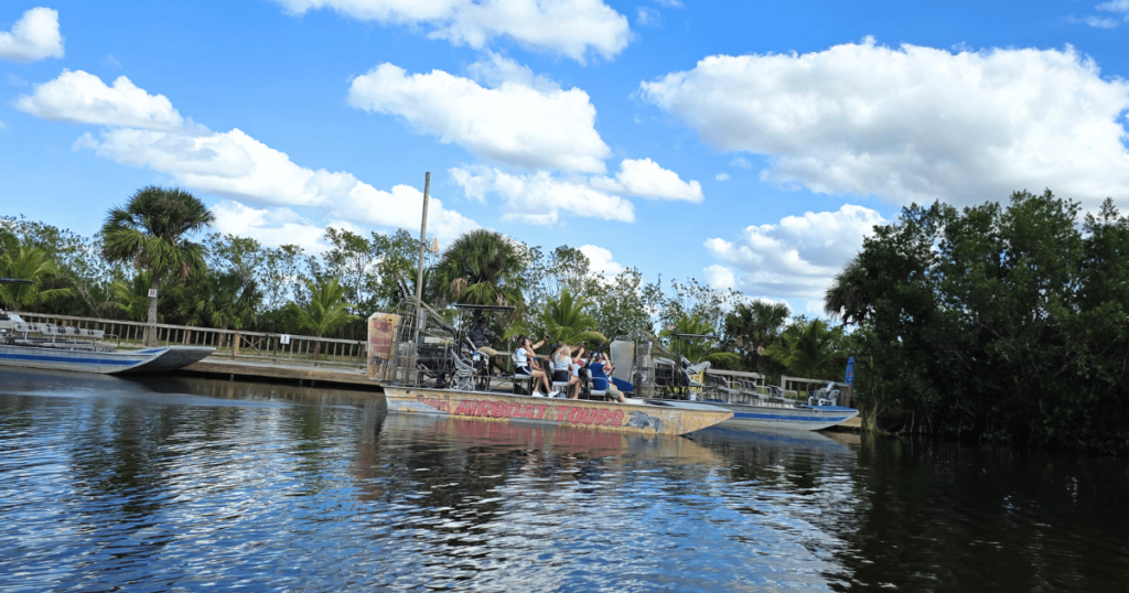 EPIC FLORIDA DAY TRIP EVERGLADES AIRBOAT RIDE AT WOOTEN'S THIS IS AN IMAGE OF AN AIRBOAT IN THE EVERGLADES AT WOOTEN'S