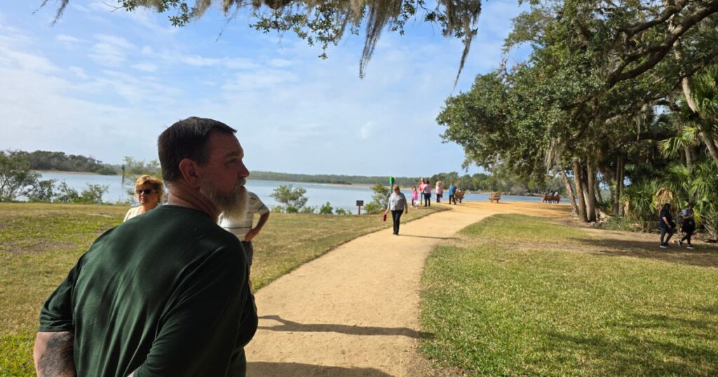 this is an image of a pathway along the water at washington oaks gardens st. augustine