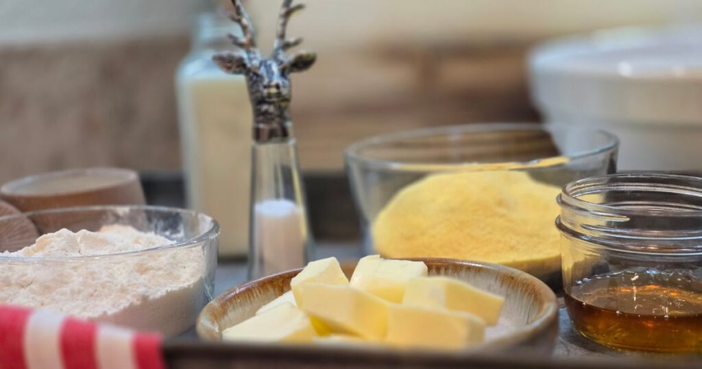 this is an image of ingredients for honey cornmeal yeast bread