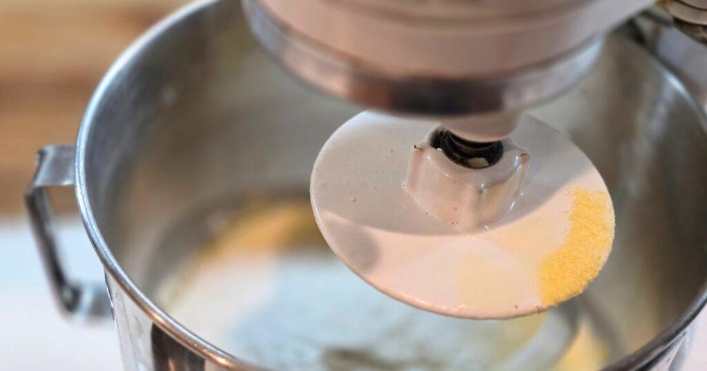 honey cornmeal yeast bread recipe mixer mixing the bread dough