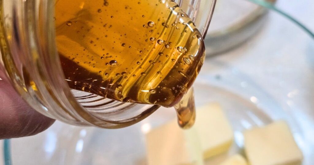 this is an image of pouring honey into a bowl