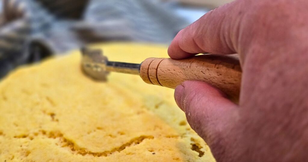 this is an image scoring the top of bread