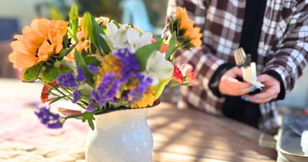 SOUTHERN FISH FRY PARTY IDEAS THIS IS AN IMAGE OF A WOMAN SETTING A TABLE OUTDOORS
