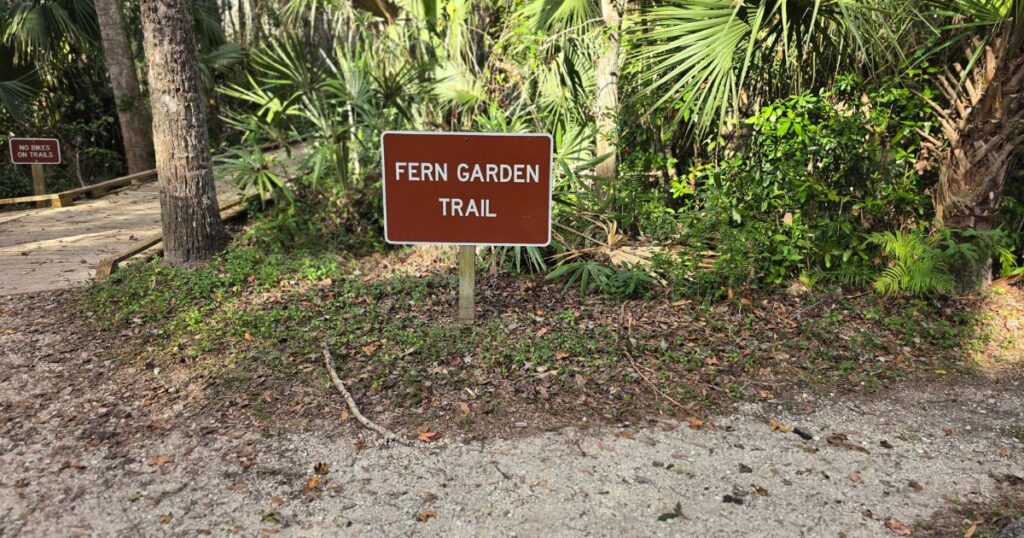 HIGHLANDS HAMMOCK STATE PARK THIS IS AN IMAGE WITH A SIGN FOR THE FERN GARDEN TRAIL