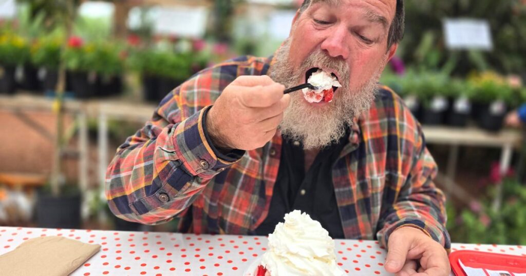 PARKDALE FARM MARKET THIS IS AA IMAGE OF A MAN PUTTING STRAWBERRY SHORTCAKE IN HIS MOUTH