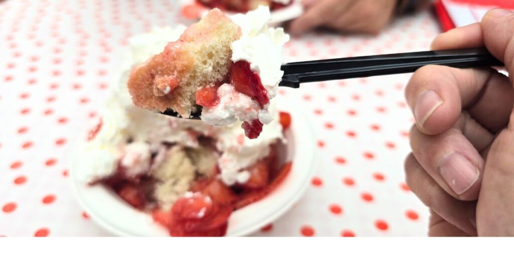 THIS IS AN IMAGE OF A SPOON IN STRAWBERRY SHORTCAKE AT PARKDALE FARM MARKET