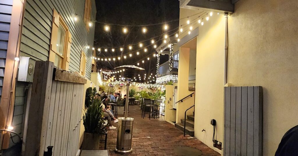 ST. AUGUSTINE FOOD CRAWL THIS IS AN IMAGE OF THE OUTSIDE OF CATCH 27 AT NIGHT WITH CAFE LIGHTS
