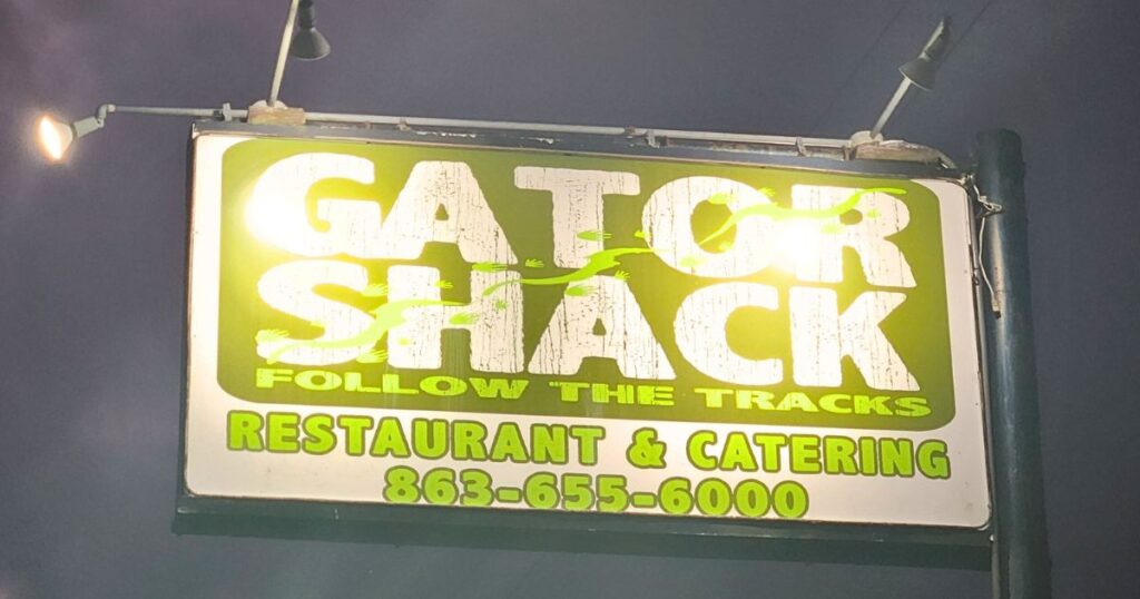 GATOR SHACK RESTAURANT THIS IS AN IMAGE OF THE OUTSIDE SIGN AT NIGHT