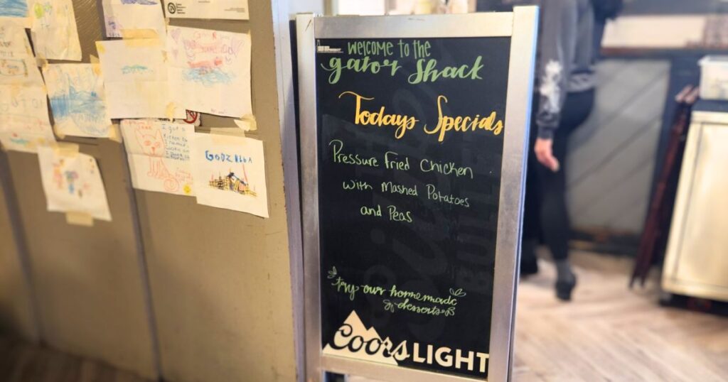 GATOR SHACK RESTAURANT THIS IS AN IMAGE OF THE DAILY SPECIALS SIGN AT THE GATOR SHACK