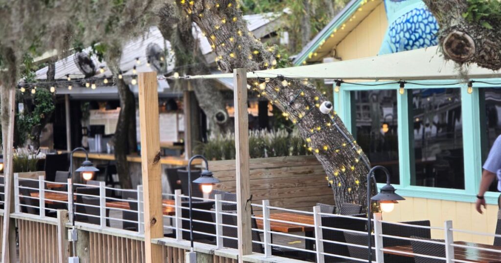 ST. AUGUSTINE HIDDEN GEM RESTAURANT WITH A VIEW IMAGE OF THE OUTSIDE DECK CAPS ON THE WATER