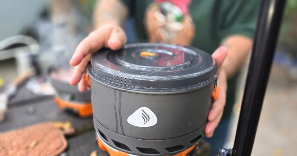 THE BEST CAR CAMPING PORTABLE KITCHEN AND SETUP THIS IS AN IMAGE OF A JENEISI BASECAMP POT