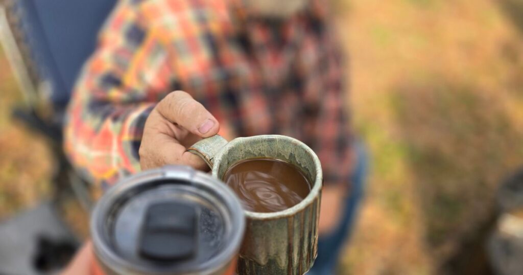 BEST CAR CAMPING PORTABLE KITCHEN THIS IS AN IMAGE OF TWO COFFEE CUPS CHEERING