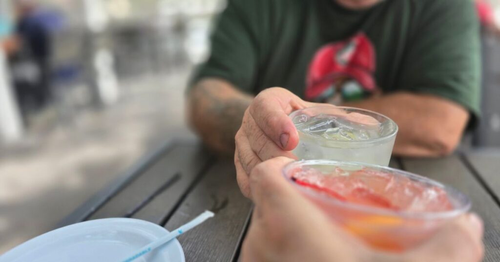 AUNT KATE'S RESTAURANT. THIS IS AN IMAGE OF TWO COCKTAILS CHEERING