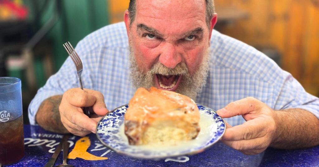 FLORIDA CRACKER KITCHEN man eating mema's giant cinnamon roll
