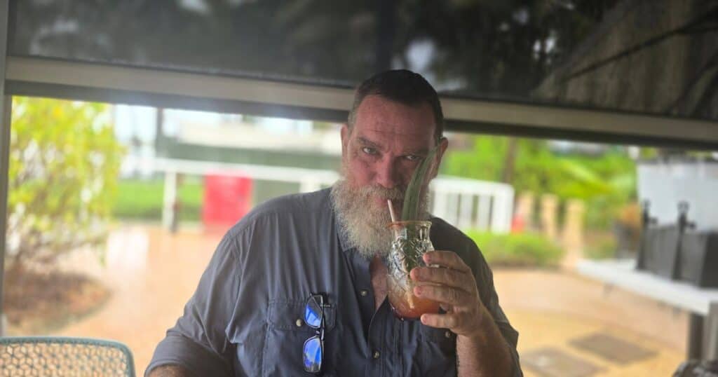 waterfront dining Jupiter, FL, man sipping craft cocktail